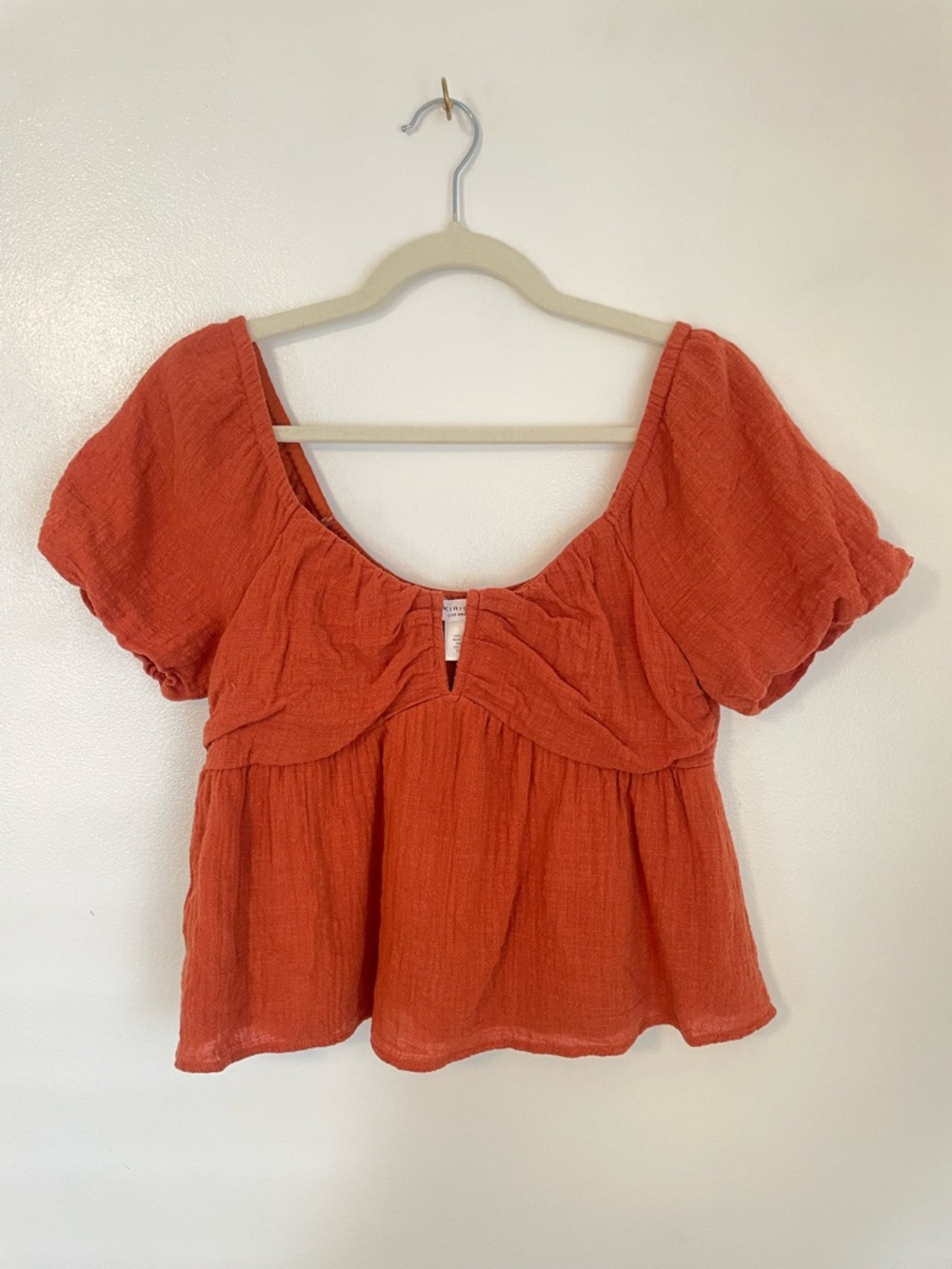 Kirious orange blouse with puff sleeves and neckline detail size medium